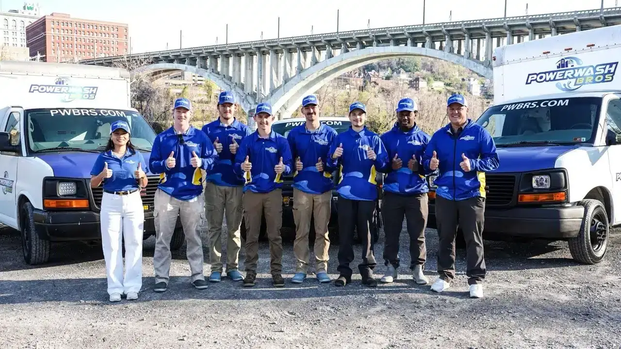 The Powerwash Bros team with their professional cleaning trucks